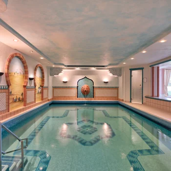 Your spa hotel in the Black Forest | Hotel Reppert Indoor pool with Moroccan design and mosaic tiles on walls and floor
